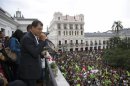 Ecuador's President Correa addresses his supporters from a balcony of Carondelet Palace in Quito