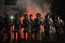 Riot police prepare to clash with demonstrators for the "Teachers' day" protest on October 15, 2013, in Sao Paulo, Brazil