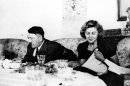FILE - This undated file picture shows the German Fuehrer Adolf Hitler and his mistress Eva Braun while dining. A German woman named Margot Woelk was one of 15 young women who sampled Hitler's food to make sure it wasn't poisoned before it was served to the Nazi leader in his "Wolf's Lair," the heavily guarded command center in what is now Poland, where he spent much of his time in the final years of World War II. Margot Woelk kept her secret hidden from the world, even from her husband then, a few months after her 95th birthday, she revealed the truth about her wartime role. (AP Photo/US Army Signal Corps from Eva Braun's album, File)