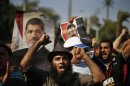 Supporters of deposed Egyptian President Mohamed Mursi shout slogans during a protest near Cairo University in Cairo