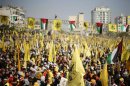 Palestinians take part in a rally marking the 48th anniversary of the founding of the Fatah movement in Gaza