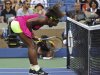 Williams of the U.S. screams after a shot against Errani of Italy during their women's semifinals match at the U.S. Open tennis tournament in New York