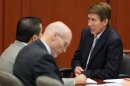 Defense counsel Mark O'Mara talks to George Zimmerman, with co-counsel Don West, center, in Seminole Circuit Court, in Sanford, Fla., Tuesday, July 9, 2013. Zimmerman is charged with second-degree murder in the fatal shooting of Trayvon Martin, an unarmed teen, in 2012. (AP Photo/Orlando Sentinel, Joe Burbank, Pool)