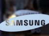 In this Jan. 8, 2013 file photo, Samsung Electronics Co. logo is seen at a showroom of its headquarters in Seoul, South Korea. The firm said Friday, April 5, 2013 its operating profit last quarter rose 53 percent over a year earlier, outpacing expectations for what's normally a slow time for consumer electronics sales. (AP Photo/Lee Jin-man, File)