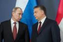A handout photo provided by the Hungarian prime minister's office shows Russian President Vladimir Putin (L) and Hungarian PM Viktor Orban at the parliament in Budapest on February 17, 2015