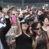 Race goers cheer the winning horse Green Moon after it won the Melbourne Cup at Flemington Racecourse in Melbourne
