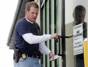 A federal agent enters VIP Cannabis dispensary in Denver …