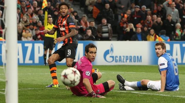 The linesman’s flag shoot up as Shakhtar Donetsk's Luiz Adriano has a shot against Real Sociedad (Reuters)