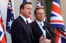 British Prime Minister David Cameron, left, and Australian Prime Minister Tony Abbott hold a joint press conference at Parliament House in Canberra, Australia, Friday, Nov. 14, 2014. Mr Cameron addressed a joint sitting of the Australian parliament ahead of the G-20 summit in Brisbane later today. (AP Photo/Alan Porritt,Pool)