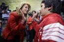 Texas Sen. Wendy Davis, D-Fort Worth, left, gives a high-five to Sam Peters, 12, after she spoke to supporters at her campaign headquarters Tuesday, March 4, 2014, in Fort Worth, Texas. Davis won the Democratic primary to run for Texas governor. (AP Photo/LM Otero)