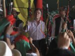 Colombia's President Juan Manuel Santos arrives for a meeting with natives from various ethnic groups in La Maria