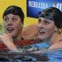 Allison Schmitt (L) and Missy Franklin check their times after their women's 200m freestyle semifinal during the U.S. Olympic swimming trials in Omaha