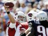 Arizona Cardinals quarterback Kevin Kolb, left, passes over New England Patriots linebacker Jermaine Cunningham (96) in the first quarter of an NFL football game, Sunday, Sept. 16, 2012, in Foxborough, Mass. (AP Photo/Elise Amendola)