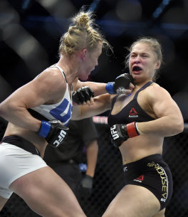Holly Holm punches Ronda Rousey during their UFC 193 fight. (AP)