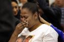 Nailah Winkfield, mother of 13-year-old Jahi McMath, cries before a courtroom hearing regarding McMath, Friday, Dec. 20, 2013, in Oakland, Calif. McMath remains on life support at Children's Hospital Oakland nearly a week after doctors declared her brain dead, following a supposedly routine tonsillectomy. (AP Photo/Ben Margot)