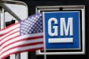 The U.S. flag flies at the Burt GM auto dealer in Denver
