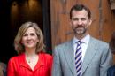 Spain's King Felipe VI (R) has issued a decree stripping his sister Princess Cristina (L) of her title as Duchess of Palma, the palace announced, as the royal sibling faces tax evasion charges in a scandal that has embarrassed the monarchy