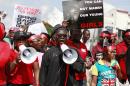 Femi Falana, a lawyer and human rights activist, centre, leads a mass-demonstration calling on the government to increase efforts to rescue the hundreds of missing kidnapped school girls of a government secondary school Chibok, in Lagos, Nigeria, Monday, May 5, 2014. Leader of a protest march Saratu Angus Ndirpaya of Chibok town, said that Nigeria's First Lady ordered her and another protest leader to be arrested Monday, and expressed doubts there was any kidnapping and accused them of belonging to the Islamic insurgent group blamed for the abductions. Police say more than 300 girls and young women were abducted mid-April from Chibok Government Girls Secondary School, of whom some 53 girls are known to have escaped. (AP Photo/ Sunday Alamba)