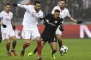 Sevilla withstand Lyon assault to reach last 16