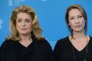 Actress Catherine Deneuve (L) and director Emmanuelle Bercot pose during a photocall for the film "On My Way" in Berlin on February 15, 2013