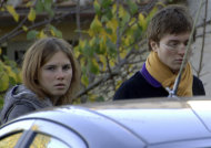 FILE - This Friday Nov. 2, 2007 file photo shows Amanda Knox, left, and Raffaele Sollecito, looking on outside the rented house where 21-year-old British student Meredith Kercher was found dead Friday, in Perugia, Italy. Italy's highest criminal court has overturned the acquittal of Amanda Knox and of her former Italian boyfriend, Raffaele Sollecito, in the slaying of her British roommate and ordered a new trial. The Court of Cassation ruled Tuesday, March 26, 2013 that an appeals court in Florence must re-hear the case against the American and her Italian-ex-boyfriend for the murder of 21-year-old Meredith Kercher (AP Photo/Stefano Medici, file)