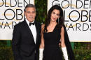 George Clooney, left, and Amal Clooney arrive at the 72nd annual Golden Globe Awards at the Beverly Hilton Hotel on Sunday, Jan. 11, 2015, in Beverly Hills, Calif. (Photo by Jordan Strauss/Invision/AP)