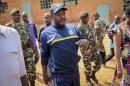 FILE - In this Tuesday, July 21, 2015 file photo, Burundi's President Pierre Nkurunziza walks to a polling station to cast his vote for the presidential election, in his hometown of Ngozi, Burundi. Burundi's military spokesman said Friday, Dec. 11, 2015 that a number of members of a group that attacked three military camps in a bid to steal weapons and free prisoners were killed, with other attackers arrested, as gunfire and explosions rocked the capital, frightening civilians who hid in their homes. (AP Photo/Berthier Mugiraneza, File)