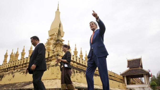 U.S. Secretary of State John Kerry, right, tours Pha Tha Luang in Vientiane, with Phouvieng Phothisane, acting director of the Vientiane Museums, far left, and Tata Keovilay, with the U.S. Embassy, Laos, Monday, Jan. 25, 2016. The massive gold stupa is the most important national symbol in Laos. Kerry is in Laos on the third leg of his latest round-the-world diplomatic mission, which will also take him to Cambodia and China. (AP Photo/Jacquelyn Martin, Pool)