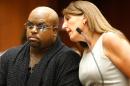 Singer Cee Lo Green (L), whose real name is Thomas DeCarlo Callaway, speaks with attorney Blair Berk at the Clara Shortridge Foltz Criminal Justice Center in Downtown Los Angeles on October 21, 2013