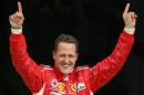 Ferrari Formula One driver Schumacher of Germany celebrates after taking the pole position at the end of the qualifying session for the Bahrain Formula One Grand Prix at the Sakhir racetrack in Manama, file