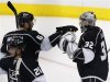 Los Angeles Kings' Quick celebrates defeating San Jose Sharks with Muzzin following their NHL Western Conference semifinal playoff hockey game in Los Angeles
