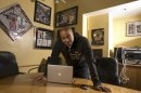 FILE - This Feb. 28, 2007 file photo shows hip-hop mogul Chris Lighty in his office in New York. Lightly died of an apparent gunshot wound on Thursday, Aug. 30, 2012 at his home in the Bronx borough of New York. He was 44. Lighty was the man behind rap's leading figures, helping them not only attain hit records, but lucrative careers outside of music. He had been a part of the rap scene for decades, working with pioneers like LL Cool J, KRS-One before starting his own management company, Violator. (AP Photo/Jim Cooper, file)