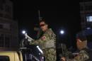 Afghan security personnel arrive at the site of an attack in Kabul