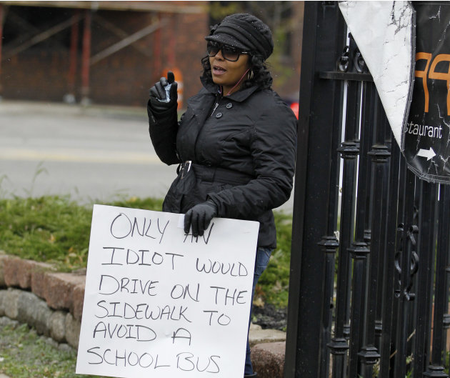 Shena Hardin holds up a sign …