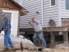 Workers dismantle shattered concrete in front of a storm-wrecked house on the beachfront in Manasquan, N.J., Saturday, May 25, 2013. Communities that were hard-hit by Superstorm Sandy, including Manasquan, are hoping for a profitable summer season to help them recover. (AP Photo/Wayne Parry)