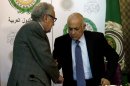 U.N.-Arab League envoy to Syria Lakhdar Brahimi, left, shakes hands with Arab League Secretary-General Nabil Elaraby following a joint press conference at the Arab League headquarters in Cairo, Egypt, Sunday, Dec. 30, 2012. The international envoy to Syria warned Sunday that as many as 100,000 could die in the next year if a solution is not reached quickly to end the countryâ€™s civil war. (AP Photo/Nasser Nasser)