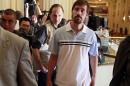 U.S. journalist James Foley arrives, after being released by the Libyan government, at Rixos hotel in Tripoli