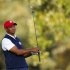 U.S. golfer Tiger Woods hits his tee shot on the 15th hole during the afternoon four-ball round at the 39th Ryder Cup golf matches at the Medinah Country Club