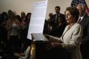 U.S. House Minority Leader Nancy Pelosi (D-CA) talks to the media on Obamacare following a Caucus meeting on Capitol Hill in Washington
