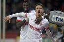 Monaco's scorer Lucas Ocampos, right, and his teammate Tiemoue Bakayoko, left, celebrate their side's first goal during the Champions League group C soccer match between Bayer 04 Leverkusen and AS Monaco in Leverkusen, Germany, Wednesday, Nov. 26, 2014. (AP Photo/Martin Meissner)