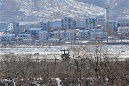 A North Korean guard post (C) in the propaganda village of Gijeongdong is seen from South Korea's Taesungdong freedom village, near the border village of Panmunjom, during a graduation ceremony for Taesungdong Elementary School, in Paju, February 15, 2013. REUTERS/Jung Yeon-je/Pool