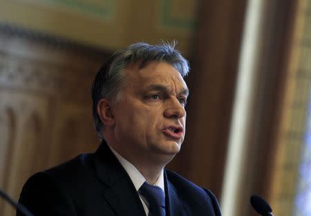 Hungarian PM Orban speaks during a news conference with central bank Governor Matolcsy in Budapest