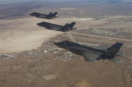 Three F-35 Joint Strike Fighters (rear to front) AF-2, AF-3 and AF-4, can be seen flying over Edwards Air Force Base in this December 10, 2011 handout photo provided by Lockheed Martin. REUTERS/Lockheed Martin/Darin Russell/Handout