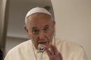 Pope Francis talks to journalists during a press conference he held aboard the papal flight on his way back to Rome at the end of a three day trip to the Midle East, Monday, May 26, 2014 (AP Photo/Andrew Medichini, Pool)