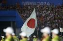 The Japanese national flag is held during the parade at the 2014 Nanjing Youth Olympic Games opening ceremony, in Nanjing