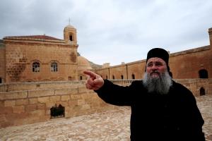A priest gestures near a church in Mardin, south-eastern&nbsp;&hellip;