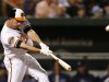Baltimore Orioles' J.J. Hardy hits a two-run home run in the third inning of a baseball game against the Tampa Bay Rays in Baltimore, Tuesday, Sept. 11, 2012. (AP Photo/Patrick Semansky)