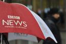 A BBC umbrella protects broadcast equipment outside the BBC's New Broadcasting House in London