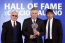 Real Madrid coach Carlo Ancelotti, center, former AC Milan and Italy coach Arrigo Sacchi, left, and Antonio Conte, coach of the Italian national team, attend the Italian Soccer Hall of Fame ceremony in Florence, Italy, Monday, Jan. 19, 2015. Ancelotti was awarded the prize as best coach. (AP Photo/Francesco Bellini)
