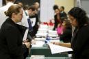 Job applicant Rose is interviewed at a "Hiring Our Heroes" military job fair in Washington